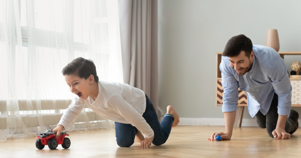 Kid playing with dad